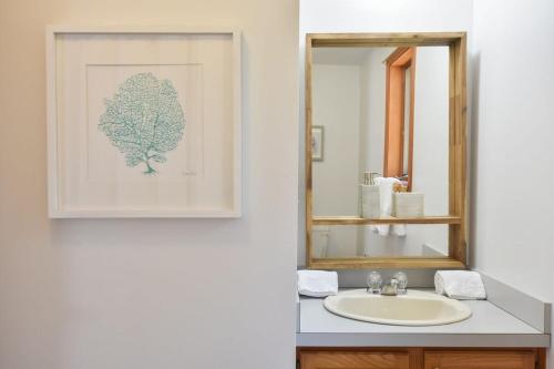 a bathroom with a sink and a mirror at 15 Min Walk to Beach w Kayaks in Wellfleet