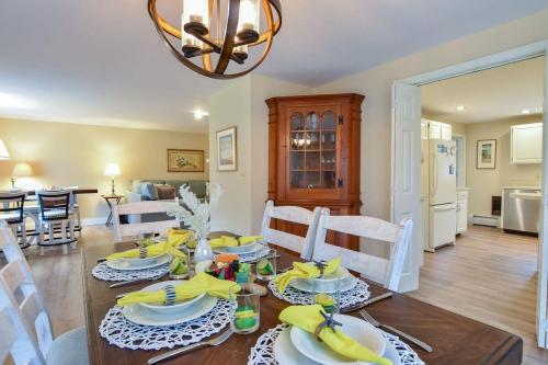 a dining room and living room with a table and chairs at Sunroom Mins to Beaches Views of Marsh in Eastham