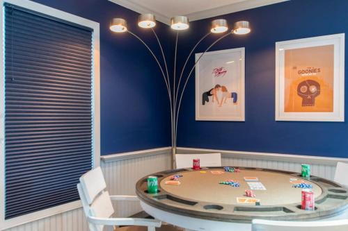 a dining room with a round table and chairs at Stellar Home with Hot Tub & Movie Room in Chatham