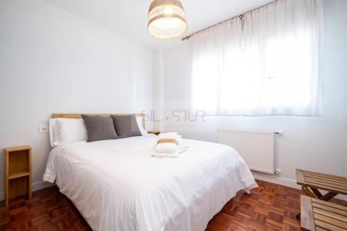 Ένα ή περισσότερα κρεβάτια σε δωμάτιο στο Mariano Moré Apartamento