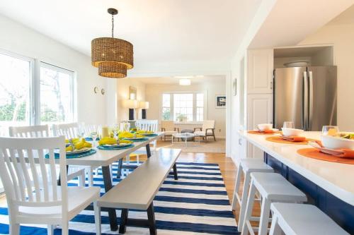 a kitchen and dining room with a table and chairs at Gorgeous Home with Game Room Dog Welcome in Chatham