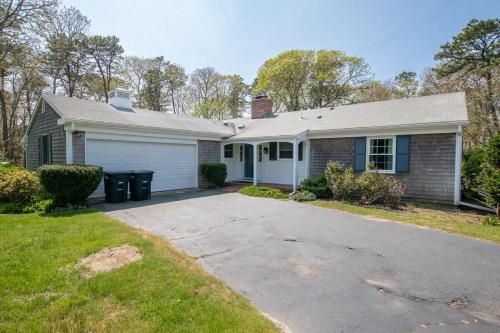 a house with a driveway in front of it at Gorgeous Home with Game Room Dog Welcome in Chatham