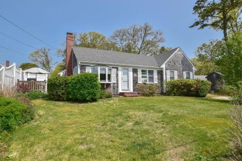 a house with a yard at 5 Min Walk to Red River Beach in Harwich