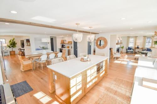 a living room with a kitchen and a dining room at Gorgeous Home 2 Min Walk to Beach in Harwich