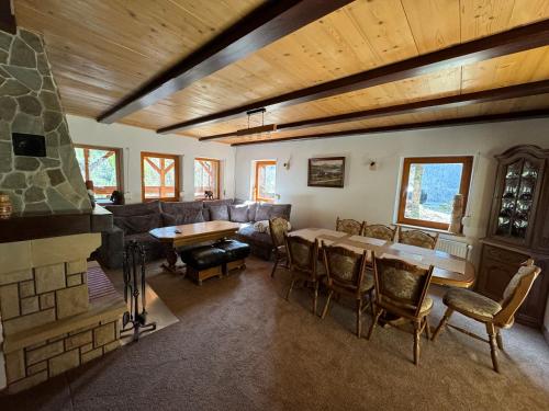 a living room with a couch and a table at Chill on Hill - Szczyrk in Szczyrk