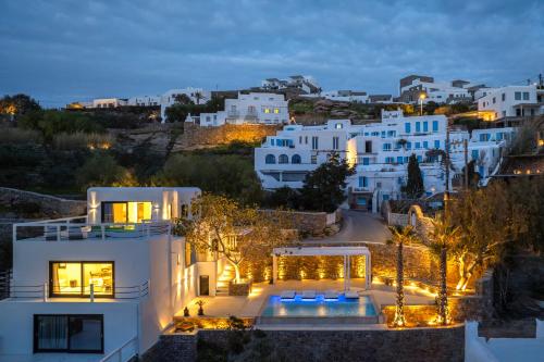 a view of a town at night with white buildings at Numi Suites in Mikonos