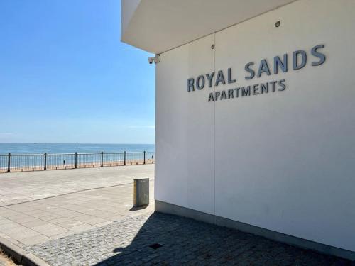 a sign on the side of a building next to the beach at SoHot Stays Sail Apt Sea Views Ground Floor Free Parking in Ramsgate