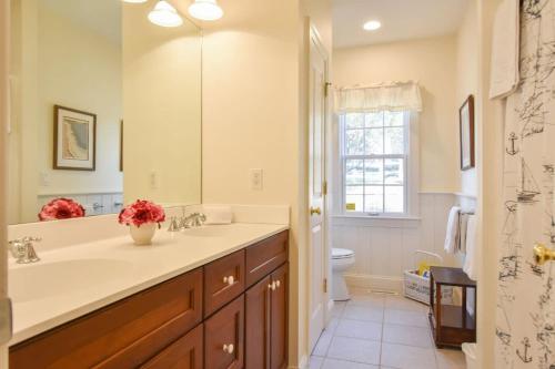 a bathroom with a sink and a toilet at Water Views & Private Tennis Court in Barnstable