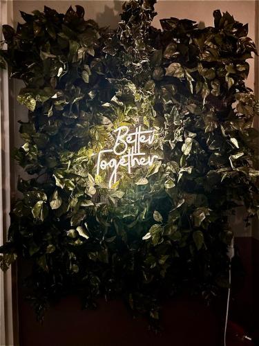 a wreath of leaves with a sign that reads better tomorrow at Casa Francigena in Vetralla