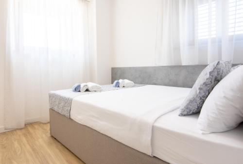 Ένα ή περισσότερα κρεβάτια σε δωμάτιο στο House Portun in the center