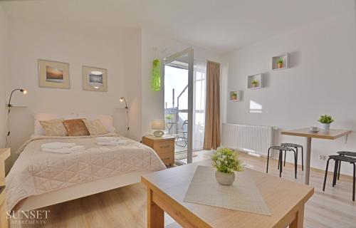 Sunset Apartments - Plac Słowiański 10 - słoneczna kawalerka w centrum miasta