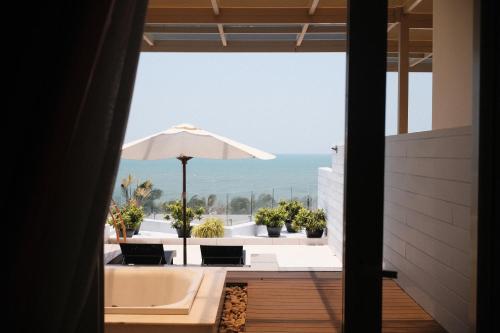 a view of the ocean from the balcony of a house at The Cliff Residence in Mui Ne