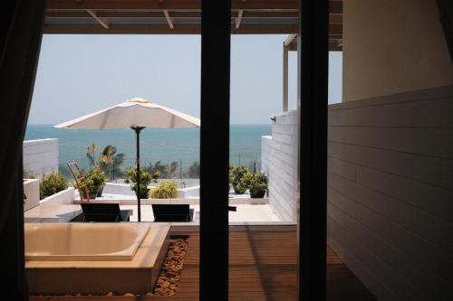 a view of the ocean from the balcony of a house at The Cliff Residence in Mui Ne
