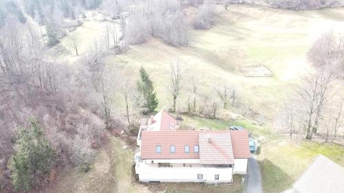 an aerial view of a house with a red roof at Holiday country house Gora in Gozd