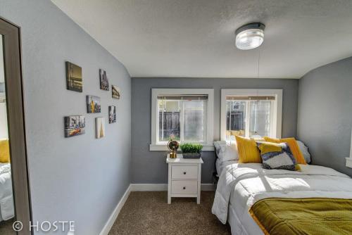 a bedroom with two beds and a window at *H* NEW! Downtown Cottage Newly Renovated! * in Colorado Springs