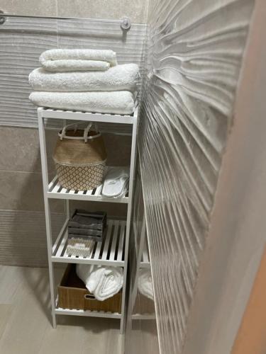 a towel rack in a bathroom with towels at ESPACE VIRAGE 2 in Dakar