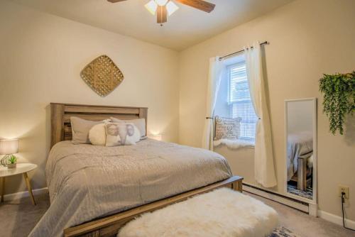 a bedroom with a large bed and a window at 2 BDS Garden Of Gods - Near it all in Colorado Springs