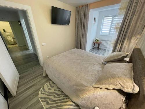 Katil atau katil-katil dalam bilik di Central Râșcani Apartment