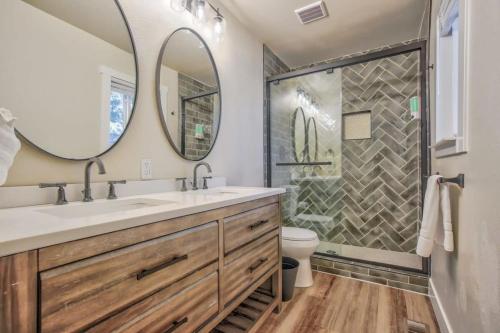 a bathroom with a sink and a shower at 4BD With Game Lounge Hot tub Dog Friendly USAFA in Pikeview