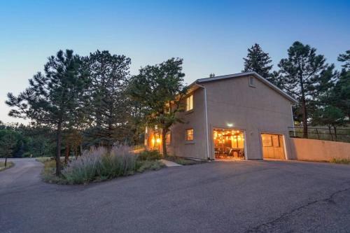 a large white building with a lot of windows at 4BD With Game Lounge Hot tub Dog Friendly USAFA in Pikeview