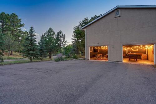 an empty parking lot in front of a building at 4BD With Game Lounge Hot tub Dog Friendly USAFA in Pikeview