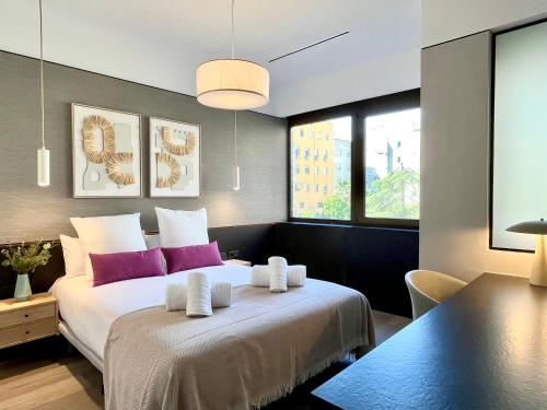 Säng eller sängar i ett rum på Feelathome Nervión Apartments