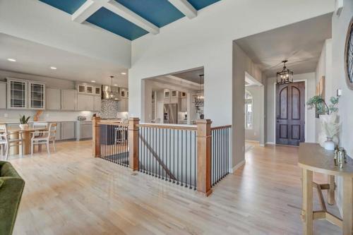 a large kitchen and living room with blue ceilings at 4BR Mountain views - Movie Theater - Pool Table in Monument