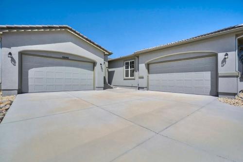 a house with two garage doors in a driveway at 4BR Mountain views - Movie Theater - Pool Table in Monument