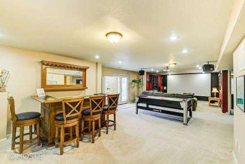 a large room with a bar and a pool table at *H* 5BR Home Getaway w/HOT TUB ** in Pikeview