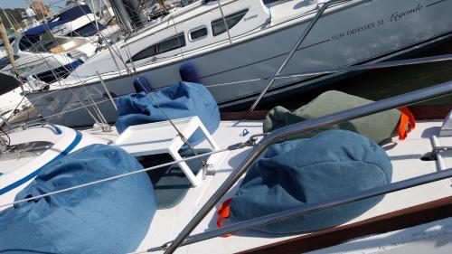 a boat with blue pillows on the side of it at Navegar no Douro - Navegação e Turismo Unipessoal, Lda in Vila Nova de Gaia