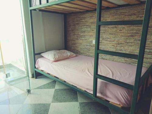 a bunk bed in a room with a pillow on it at My Hostel in Dahab - Dive center in Dahab