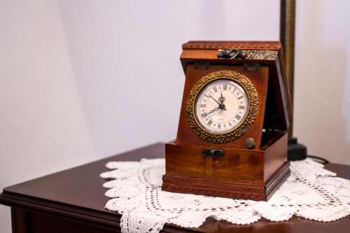 a clock sitting on top of a table at Lithies Traditional Homes in Firostefani