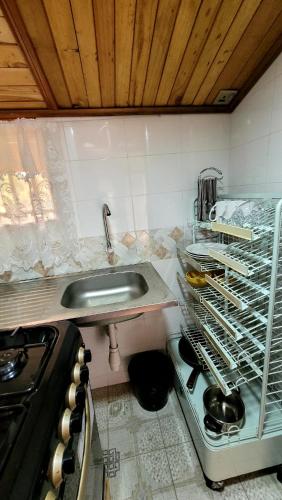 a kitchen with a sink and a counter top at Ugatrac tours and travel in Kampala