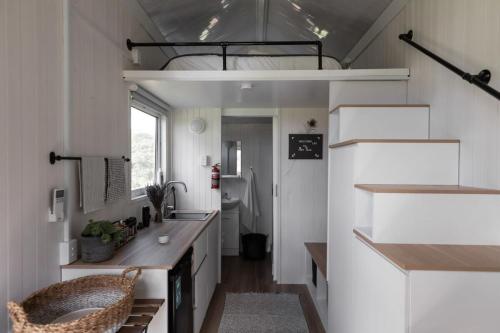 a tiny house with a sink and a bathroom at Tiny Inja 1 in Comleroy