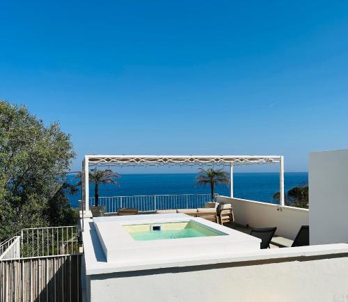 a swimming pool on the roof of a house at Cottage Vittoria - Marina di Novaglie in Gagliano del Capo