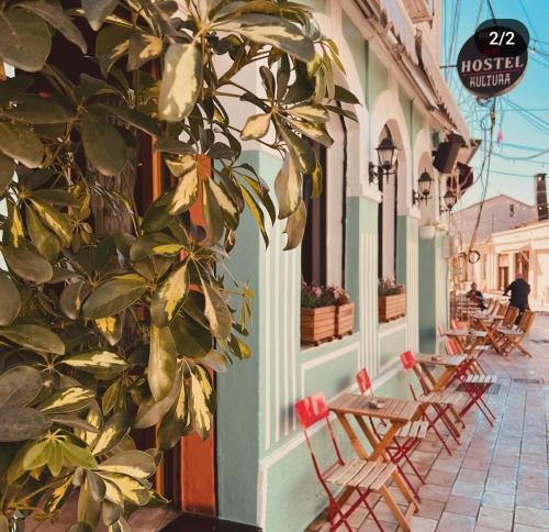 a row of chairs sitting outside of a building at Kultura Hostel in Shkodër