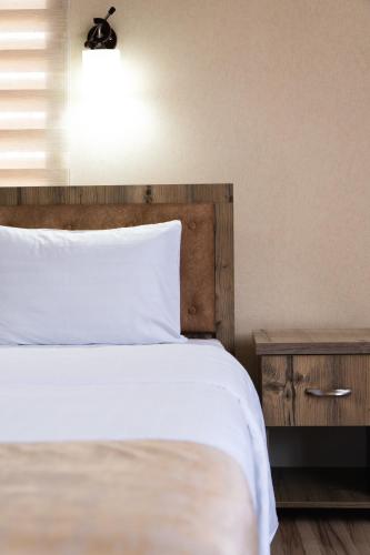 Кровать или кровати в номере TOURIST INN hotel