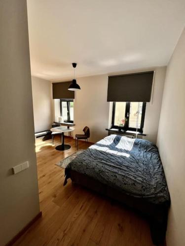 Ліжко або ліжка в номері Riga's Essence: Stylish City Apartment
