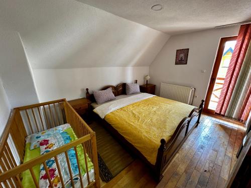 a bedroom with a large bed and a window at Holiday home Krajina I in Vlasic