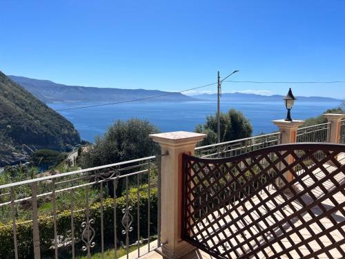 a balcony with a view of the water at La Marinella in Palmi