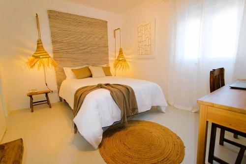 a bedroom with a bed and a large window at Casa Digo - Bright & Stylish in Lagos