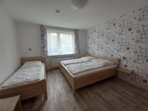 Postel nebo postele na pokoji v ubytování Feriencamp Trassenheide