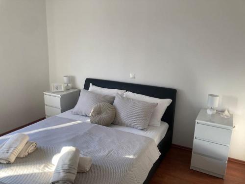 a bedroom with a large bed with two night stands at Central City Nest - Sandra&David in Zadar