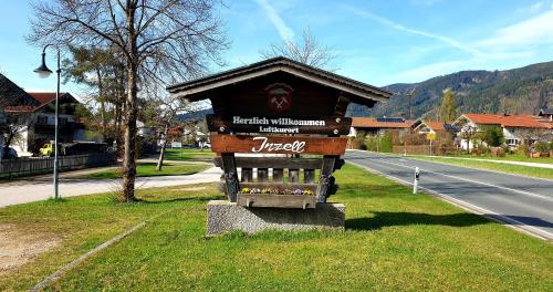 a small kiosk on the side of a road at Alpenhotel Gastager in Inzell