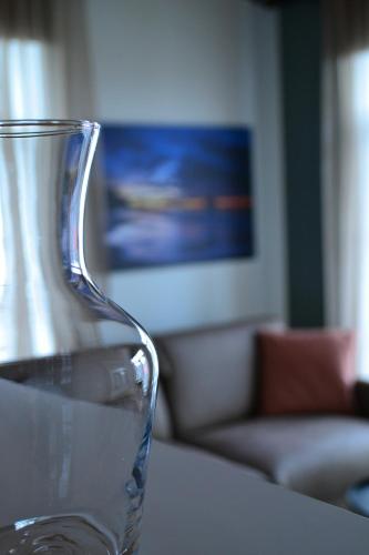 a glass vase sitting on top of a table at Andenes Suitehotel in Andenes