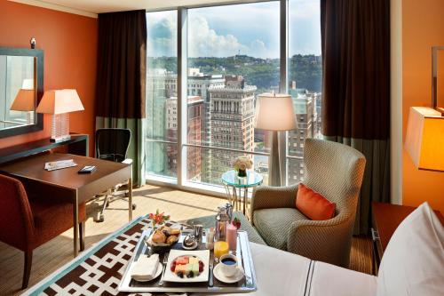 a hotel room with a view of a city at Fairmont Pittsburgh in Pittsburgh