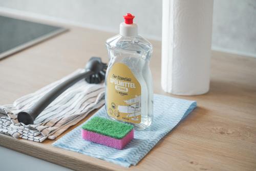 a bottle of laundry detergent sitting on top of a towel at Monteurwohnungen in Göppingen 04-07 in Göppingen