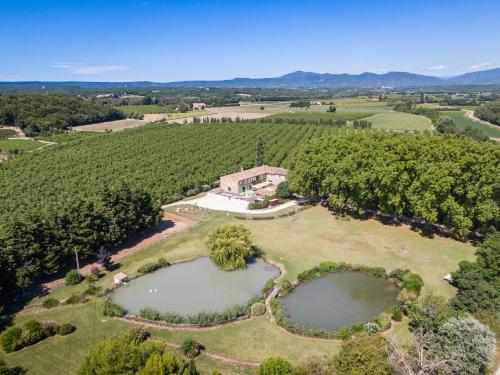 an aerial view of an estate with two ponds at Mas Loisonville - Demeure d'exception & Spa en Drôme Provençale in Grillon