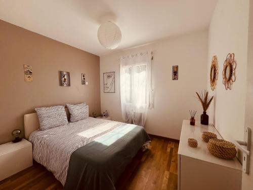 Postel nebo postele na pokoji v ubytování La villa Casa Vaunage