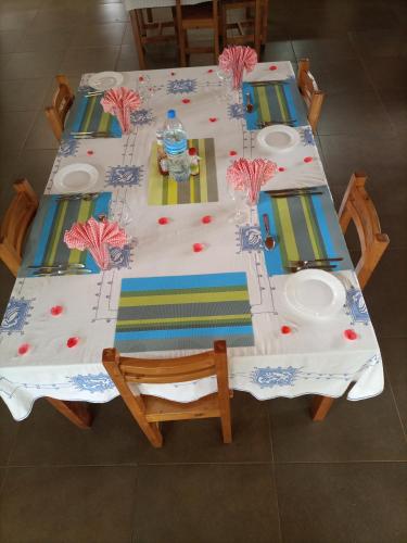 a table with a birthday cake on top of it at STC.SAFARI LODGE in Oldeani